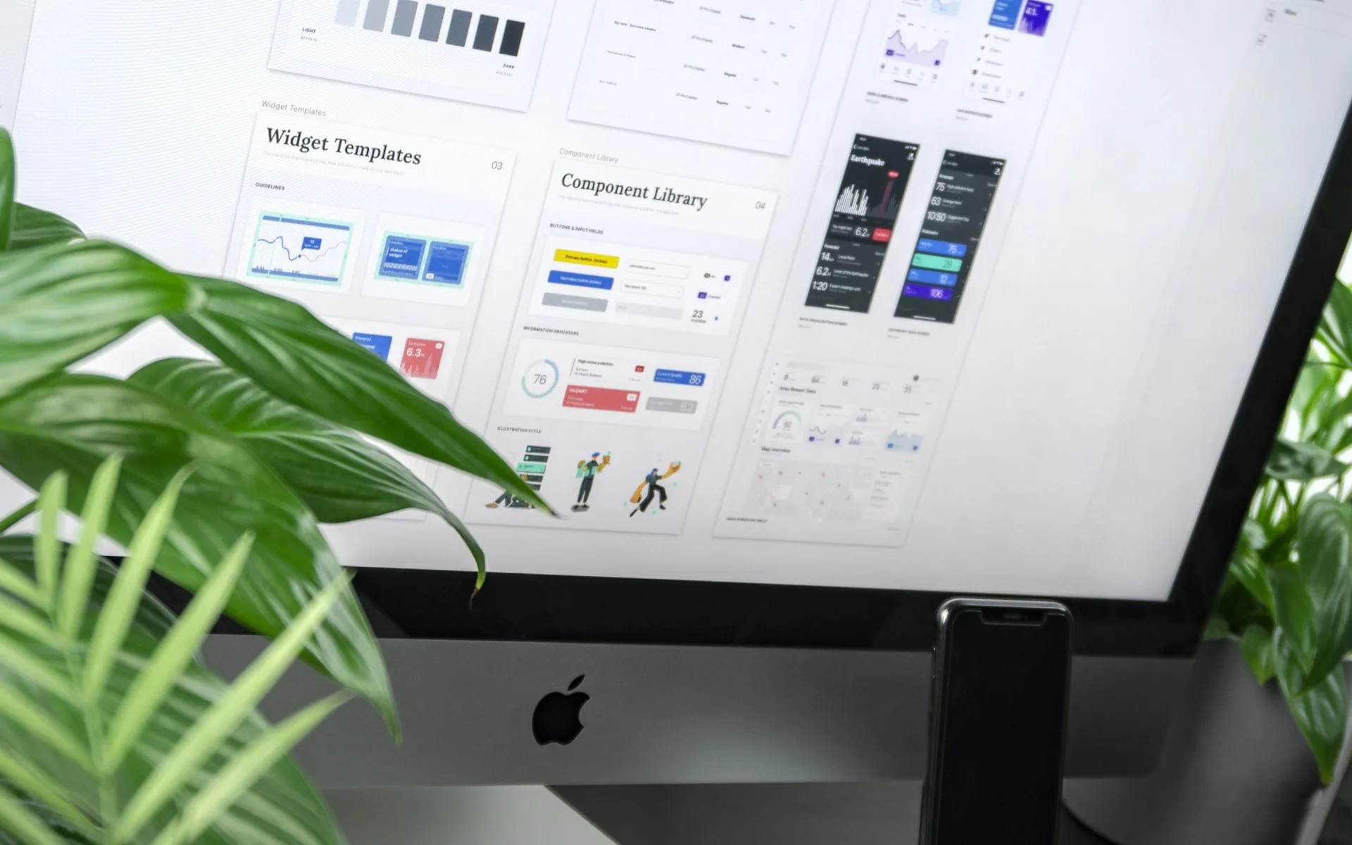 A silver iMac displaying a colorful gradient design, representing modern web design trends